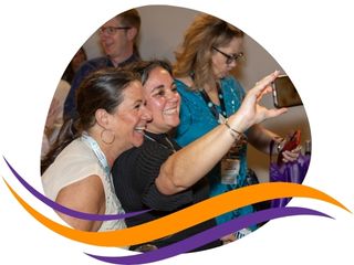 A photo of two women taking a selfie together at an msp summit networking event
